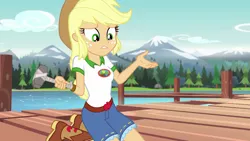 Size: 1280x720 | Tagged: safe, derpibooru import, screencap, applejack, equestria girls, legend of everfree, boots, camp everfree outfits, cowboy boots, cowboy hat, cute, denim shorts, female, freckles, hammer, hat, lake, mountain, pier, solo, stetson, tree