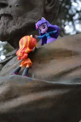 Size: 4000x6000 | Tagged: safe, artist:hero1290, derpibooru import, sunset shimmer, twilight sparkle, equestria girls, absurd resolution, climbing, doll, duo, equestria girls minis, eqventures of the minis, help, irl, photo, statue, toy