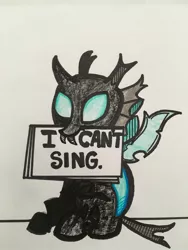 Size: 1024x1365 | Tagged: artist:aperaturescience, bob dylan, changeling, derpibooru import, mouth hold, safe, sign, solo, song reference, subterranean homesick blues, the times they are a changeling, thorax, traditional art