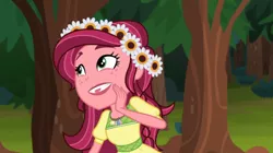 Size: 842x473 | Tagged: safe, derpibooru import, screencap, gloriosa daisy, equestria girls, legend of everfree, geode of fauna, geode of shielding, geode of sugar bombs, geode of super speed, geode of super strength, magical geodes, solo, tongue bite
