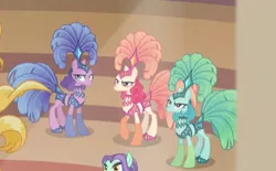 Size: 371x230 | Tagged: safe, derpibooru import, screencap, emerald flare, sapphire sequins, sunset circus, zen moment, earth pony, pony, viva las pegasus, angry, background pony, cropped, female, mare, midriff, show mares, showgirl, unamused