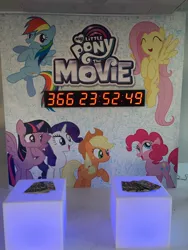 Size: 1536x2048 | Tagged: safe, derpibooru import, idw, applejack, fluttershy, pinkie pie, rainbow dash, rarity, twilight sparkle, twilight sparkle (alicorn), alicorn, pony, my little pony: the movie, 2016, comic, countdown, cutie mark, guardians of harmony, hype, irl, mane six, movie, my little pony logo, nycc 2016, photo