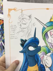 Size: 768x1024 | Tagged: artist:andypriceart, derpibooru import, looking at you, magic shirt, photo, princess celestia, princess luna, safe, traditional art, unamused