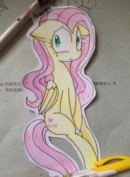 Size: 1888x2560 | Tagged: artist:meczycuta, craft, cutout, derpibooru import, floppy ears, fluttershy, folded wings, looking at you, paper child, papercraft, photo, safe, sitting, solo, traditional art, unhappy