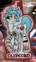 Size: 578x1000 | Tagged: safe, artist:onnanoko, derpibooru import, oc, oc:clipcord, unofficial characters only, pony, unicorn, ear piercing, earring, female, jewelry, mare, nose piercing, photo, piercing, solo, tattoo, traditional art