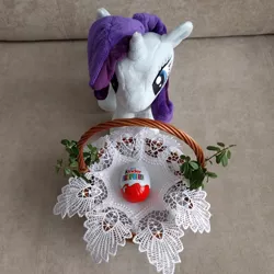 Size: 1600x1600 | Tagged: safe, derpibooru import, rarity, pony, 4de, basket, chocolate, doily, easter, food, holiday, irl, kinder egg, leaves, photo, plushie, rarity looking at food, solo, toy