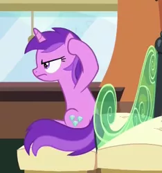Size: 347x370 | Tagged: safe, derpibooru import, screencap, amethyst star, pony, unicorn, rock solid friendship, amethyst star is not amused, annoyed, background pony, covering ears, cropped, female, friendship express, mare, sitting, solo, train