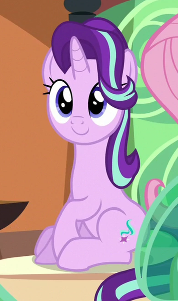 Size: 388x654 | Tagged: safe, derpibooru import, screencap, fluttershy, starlight glimmer, pony, unicorn, the crystalling, c:, cropped, cute, female, glimmerbetes, mare, raised hoof, sitting, smiling, solo focus, train