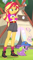 Size: 374x676 | Tagged: safe, derpibooru import, screencap, spike, spike the regular dog, sunset shimmer, dog, equestria girls, legend of everfree, boots, camp everfree outfits, clothes, crossed arms, legs, mountain, shorts, socks, sun, tent, tree