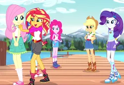 Size: 932x636 | Tagged: safe, derpibooru import, screencap, applejack, fluttershy, pinkie pie, rainbow dash, rarity, sunset shimmer, equestria girls, legend of everfree, balloon, boots, bracelet, camp everfree outfits, clothes, converse, cowboy boots, cute, embrace the magic, heart, humane five, jewelry, mountain, pier, raised leg, river, shoes, shorts, sneakers, socks, sun, tree