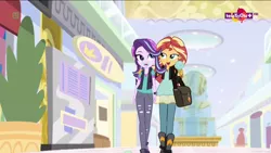 Size: 1600x900 | Tagged: safe, derpibooru import, screencap, starlight glimmer, sunset shimmer, equestria girls, mirror magic, spoiler:eqg specials, bag, beanie, bedroom eyes, boots, clothes, duo, female, food, geode of empathy, hat, ice cream, jacket, leather jacket, lidded eyes, magical geodes, ripped pants, shoes, skirt, vest, walking
