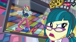 Size: 1920x1080 | Tagged: safe, derpibooru import, screencap, juniper montage, lemon zest, rainbow dash, dance magic, equestria girls, mirror magic, spoiler:eqg specials, backwards ballcap, baseball cap, boots, cap, clothes, ear piercing, earring, female, glasses, hat, jewelry, piercing, ponied up, rapper dash, shoes, skirt, sneakers, teletoon, television, upset