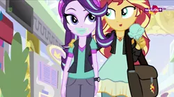 Size: 1366x767 | Tagged: safe, derpibooru import, screencap, starlight glimmer, sunset shimmer, equestria girls, mirror magic, spoiler:eqg specials, bag, beanie, clothes, eating, face, food, geode of empathy, hat, hug, ice cream, ice cream cone, magical geodes, messy eating, teletoon, thick, wat, wide hips
