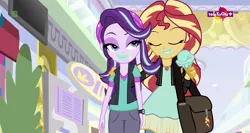 Size: 1364x724 | Tagged: safe, derpibooru import, edit, edited screencap, screencap, starlight glimmer, sunset shimmer, equestria girls, mirror magic, spoiler:eqg specials, bag, beanie, clothes, eating, female, food, geode of empathy, hat, hug, ice cream, jacket, jewelry, leather jacket, lesbian, lidded eyes, looking at each other, magical geodes, messy eating, necklace, pendant, shimmerglimmer, shipping, teletoon, thick, watch, wide hips