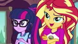 Size: 1280x720 | Tagged: safe, derpibooru import, screencap, sci-twi, sunset shimmer, twilight sparkle, equestria girls, legend of everfree, camp everfree outfits, clothes, crossed arms, duo, female, glasses, indoors, open mouth, raised eyebrow