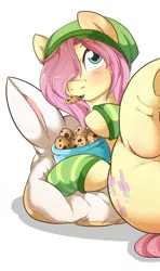 Size: 664x1125 | Tagged: suggestive, artist:rainbowscreen, artist:rainbowscreen edit, derpibooru import, edit, fluttershy, pony, beanie, butterscotch, clothes, cookie, cropcon, cropped, eating, explicit source, femboy, food, gloves, hat, male, pillow, rule 63, solo, solo male