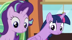 Size: 1920x1080 | Tagged: safe, derpibooru import, screencap, starlight glimmer, twilight sparkle, twilight sparkle (alicorn), alicorn, pony, unicorn, the times they are a changeling, cute, duo, duo female, female, glimmerbetes, leaning, looking down, out of focus, seat, smiling, train, twiabetes, window