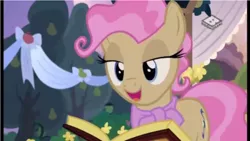 Size: 961x541 | Tagged: safe, derpibooru import, screencap, mayor mare, pony, the perfect pear, book, lidded eyes, marriage, non-dyed mayor, wedding, younger