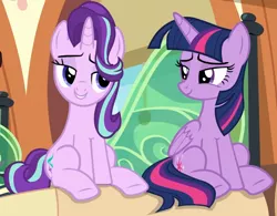 Size: 880x686 | Tagged: safe, derpibooru import, screencap, starlight glimmer, twilight sparkle, twilight sparkle (alicorn), alicorn, pony, unicorn, the times they are a changeling, cropped, lidded eyes, looking at each other, sitting, smiling, smug, smuglight glimmer, smuglight sparkle, train