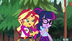 Size: 1280x720 | Tagged: safe, derpibooru import, screencap, sci-twi, sunset shimmer, twilight sparkle, equestria girls, legend of everfree, camp everfree outfits, clothes, duffle bag, fist, glasses, open mouth, shorts