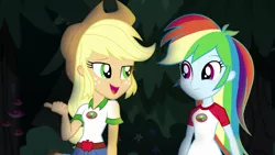 Size: 1280x720 | Tagged: safe, derpibooru import, screencap, applejack, rainbow dash, equestria girls, legend of everfree, belt, camp everfree outfits, clothes, cowboy hat, denim shorts, duo, freckles, hat, open mouth, pointing, smiling, stetson, talking