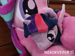 Size: 600x450 | Tagged: safe, artist:nekokevin, derpibooru import, starlight glimmer, twilight sparkle, twilight sparkle (alicorn), alicorn, pony, unicorn, series:nekokevin's glimmy, 4de, adorable distress, animated, clothes, cuddling, cute, daaaaaaaaaaaw, female, gif, glimmerbetes, hape, head shake, hug, irl, mare, nekokevin is trying to murder us, non-consensual cuddling, photo, plushie, size difference, socks, starlight's little twibird, stop motion, striped socks, struggle snuggle, the weak should fear the strong, twiabetes