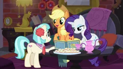 Size: 1280x720 | Tagged: safe, derpibooru import, screencap, applejack, coco pommel, rarity, earth pony, pony, unicorn, made in manehattan, cello, coco's apartment, couch, cup, female, mare, musical instrument, photo album, teacup, teapot