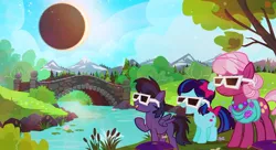Size: 1000x545 | Tagged: safe, artist:pixelkitties, derpibooru import, cheerilee, oc, earth pony, pegasus, pony, 2017 solar eclipse, bow, bridge, clothes, colt, eclipse, eclipse glasses, eyewear, female, filly, glasses, hair bow, jewelry, male, mare, moon, mountain, mountain range, necklace, ponyville park, protective glasses, river, scarf, solar eclipse, sun