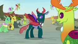 Size: 1280x720 | Tagged: safe, derpibooru import, screencap, pharynx, thorax, changedling, changeling, to change a changeling, changedling brothers, king thorax, looking at self, open mouth, prince pharynx, raised hoof, spread wings, wings
