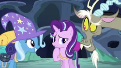 Size: 1280x720 | Tagged: safe, derpibooru import, screencap, discord, starlight glimmer, trixie, draconequus, pony, unicorn, to where and back again, clothes, female, grin, hat, male, mare, raised eyebrow, raised hoof, smiling, trio, trixie's hat, wizard hat