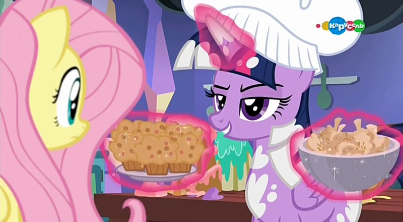 Size: 854x470 | Tagged: safe, derpibooru import, screencap, fluttershy, twilight sparkle, twilight sparkle (alicorn), alicorn, pegasus, pony, a health of information, carousel (tv channel), cauliflower bite, chef's hat, duo, food, hat, muffin, sweet potato muffin