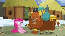 Size: 1280x720 | Tagged: safe, derpibooru import, screencap, pinkie pie, prince rutherford, earth pony, pony, yak, not asking for trouble, cloven hooves, crown, ear piercing, earring, female, horn ring, hut, jewelry, male, piercing, regalia, sitting, yakyakistan