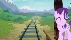 Size: 1920x1080 | Tagged: safe, derpibooru import, screencap, starlight glimmer, pony, unicorn, uncommon bond, adorkable, cute, dork, eyes closed, female, glimmerbetes, happy, mare, mountain, railroad, raised hoof, scenery, solo, tracks, train station