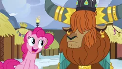 Size: 1280x720 | Tagged: safe, derpibooru import, screencap, pinkie pie, prince rutherford, earth pony, pony, yak, not asking for trouble, crown, ear piercing, earring, female, happy, horn ring, hut, jewelry, male, mare, piercing, regalia