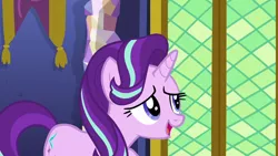 Size: 1280x720 | Tagged: safe, derpibooru import, screencap, starlight glimmer, pony, unicorn, the crystalling, cute, door, female, glimmerbetes, indoors, mare, open mouth, raised hoof, shy, smiling, solo, standing, twilight's castle
