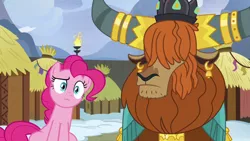 Size: 1280x720 | Tagged: safe, derpibooru import, screencap, pinkie pie, prince rutherford, earth pony, pony, yak, not asking for trouble, crown, duo, ear piercing, earring, female, horn ring, hut, jewelry, male, mare, piercing, raised eyebrow, regalia