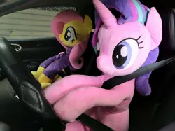 Size: 1199x899 | Tagged: safe, artist:nekokevin, derpibooru import, fluttershy, starlight glimmer, pegasus, pony, unicorn, series:nekokevin's glimmy, car, clothes, cute, driving, duo, female, glimmerbetes, irl, life size, mare, photo, plushie, seatbelt, shyabetes, sitting, smiling, steering wheel, sweater, sweatershy, this will not end well