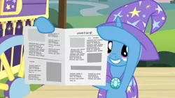 Size: 1280x720 | Tagged: safe, derpibooru import, screencap, trixie, pony, unicorn, uncommon bond, cape, clothes, cute, diatrixes, female, hat, holding, hoof hold, magic trick, mare, newspaper, raised hoof, smiling, solo, trixie's cape, trixie's hat, written equestrian