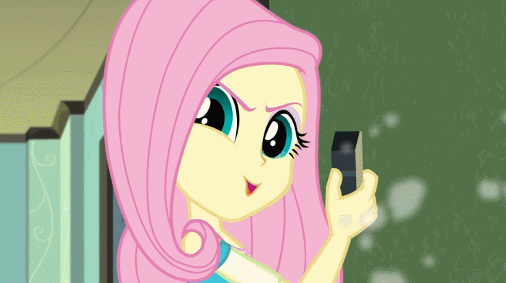 Size: 739x413 | Tagged: safe, derpibooru import, screencap, fluttershy, a little birdie told me, equestria girls, equestria girls series, animated, dramatic widescreen, evil grin, flutterbadass, grin, make my day, pure unfiltered evil, smiling, smirk, solo