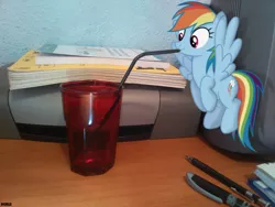 Size: 2592x1944 | Tagged: safe, artist:a4r91n, derpibooru import, rainbow dash, pegasus, pony, bendy straw, book, desk, drinking, drinking straw, floating, irl, micro, photo, ponies in real life, printer, solo, straw