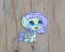 Size: 1280x1024 | Tagged: safe, artist:ladyeleanork, derpibooru import, fluttershy, pegasus, pony, blush sticker, blushing, chibi, cropped, folded wings, irl, looking up, open mouth, photo, smiling, solo, traditional art, wings