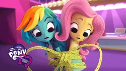 Size: 1280x720 | Tagged: safe, derpibooru import, fluttershy, rainbow dash, equestria girls, the show must go on, doll, equestria girls minis, logo, tape, ticket, tied up, toy, worried