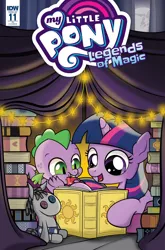 Size: 1054x1600 | Tagged: safe, artist:dsana, derpibooru import, idw, smarty pants, spike, twilight sparkle, dragon, pony, unicorn, legends of magic, spoiler:comic, spoiler:comiclom11, :t, book, cover, cute, eating, female, filly, filly twilight sparkle, gem, mare in the moon, moon, open mouth, prone, reading, ruby, smiling, tent, younger