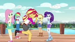 Size: 1280x720 | Tagged: safe, derpibooru import, screencap, applejack, fluttershy, rainbow dash, rarity, sunset shimmer, equestria girls, legend of everfree, camp everfree logo, camp everfree outfits, clothes, converse, embrace the magic, eyes closed, high heels, lake, open mouth, pier, shoes, shorts, singing, skirt, tanktop, twirl