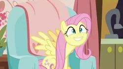 Size: 1280x720 | Tagged: safe, derpibooru import, screencap, fluttershy, pegasus, pony, discordant harmony, couch, cute, female, grin, mare, shyabetes, sitting, smiling, solo, spread wings, want, wings