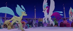 Size: 1920x804 | Tagged: safe, derpibooru import, screencap, bell perin, chocolate apple, dawn sunrays, haven bay, princess skystar, queen novo, unnamed pony, classical hippogriff, earth pony, hippogriff, pegasus, pony, my little pony: the movie, background pony, canterlot, feathered fetlocks, female, flying, landing, male, mare, market, mother and daughter, rainbow (song), reunion, running, stallion, wings