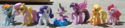 Size: 2526x579 | Tagged: safe, artist:dingopatagonico, derpibooru import, applejack, fluttershy, pinkie pie, rainbow dash, rarity, spike, twilight sparkle, twilight sparkle (alicorn), alicorn, dragon, earth pony, pegasus, pony, unicorn, female, irl, looking at you, male, mane seven, mane six, mare, photo, toy