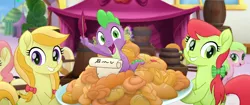 Size: 1920x804 | Tagged: safe, derpibooru import, screencap, apple cobbler, carrot top, gala appleby, golden harvest, jonagold, marmalade jalapeno popette, peachy sweet, pink lady, red gala, spike, dragon, earth pony, pony, my little pony: the movie, apple family member, background pony, barrel, bow, faic, female, food, hair bow, happy, irrational exuberance, mare, quill, smiling, we got this together