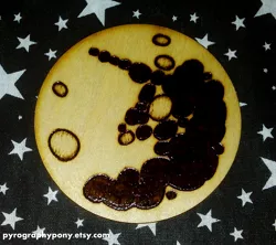 Size: 1629x1449 | Tagged: artist:aracage, coaster, derpibooru import, irl, mare in the moon, moon, photo, pyrography, safe, traditional art, woodwork