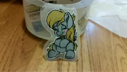 Size: 5312x2988 | Tagged: safe, artist:binkyt11, derpibooru import, derpy hooves, pegasus, pony, blush sticker, blushing, chibi, ear fluff, eyes closed, female, food, irl, mare, muffin, photo, solo, sticker, tape, traditional art